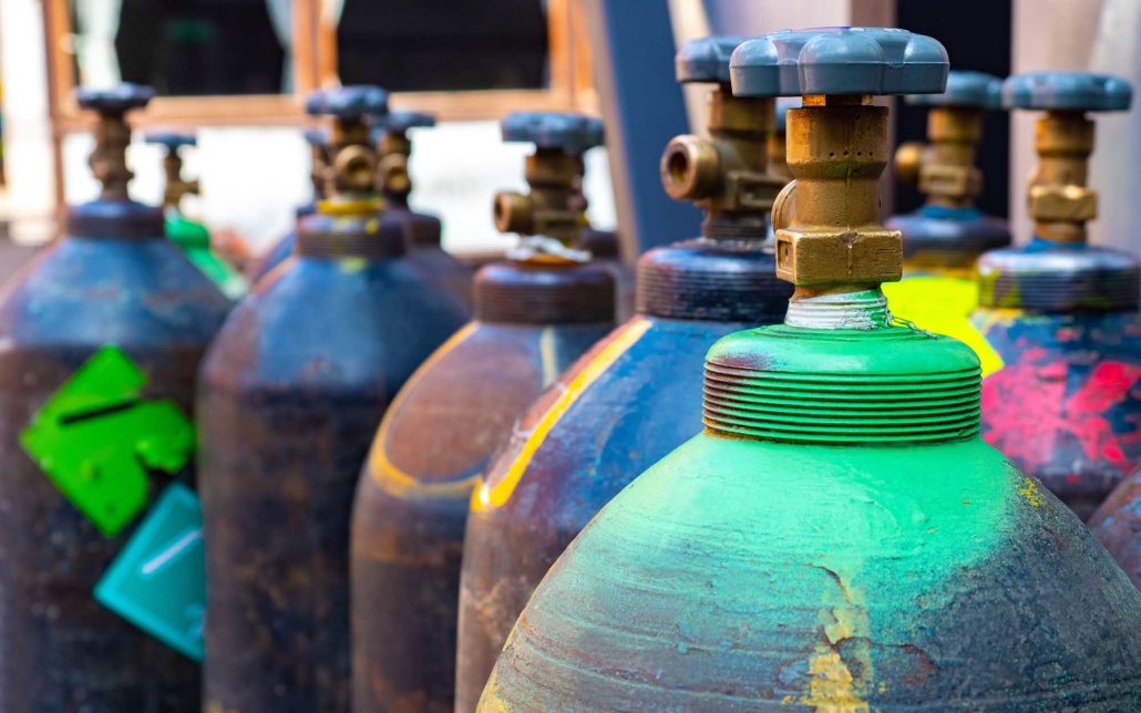 Close up view of various gas cylinders