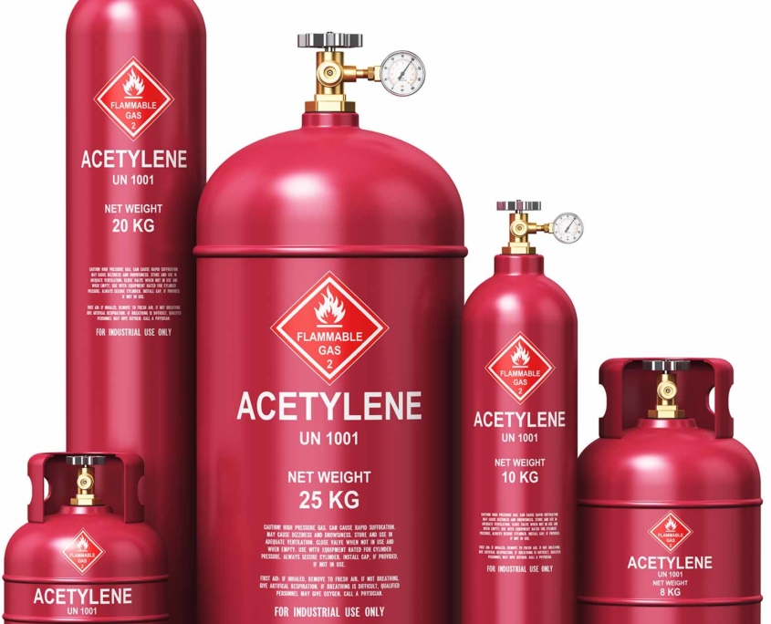 row of red multi-sized acetylene industrial gas containers